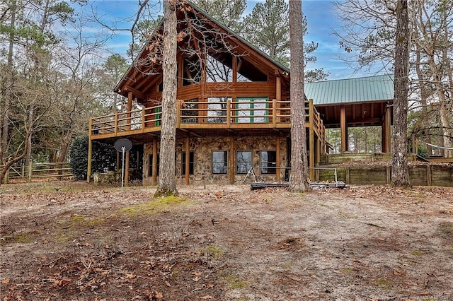back of house with a wooden deck