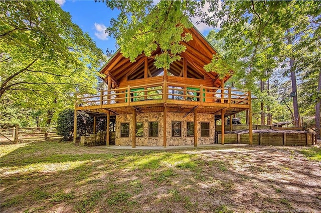 329 Silver Grove Church Rd, Rockingham, NC 28379 - back of house with a wooden deck, log siding, and stone siding