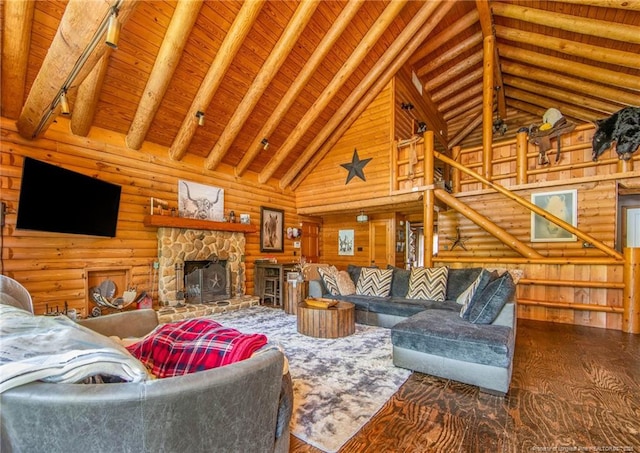 329 Silver Grove Church Rd, Rockingham, NC 28379 - living room with high vaulted ceiling, a fireplace, wood finished floors, and wooden ceiling with exposed beams