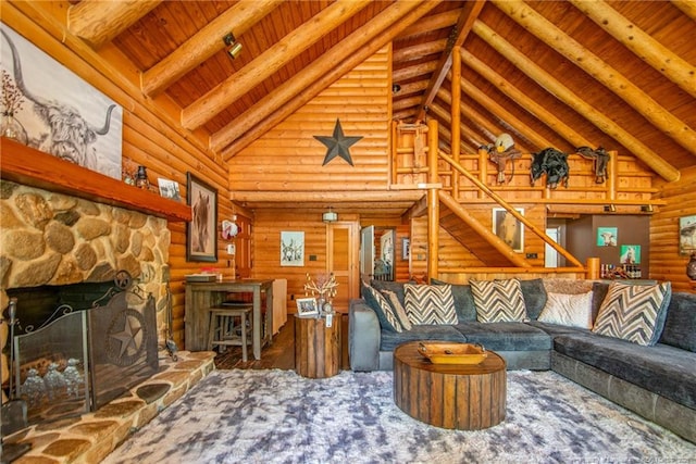 329 Silver Grove Church Rd, Rockingham, NC 28379 - living area featuring high vaulted ceiling, wooden ceiling with exposed beams, a fireplace, stairway, and log walls