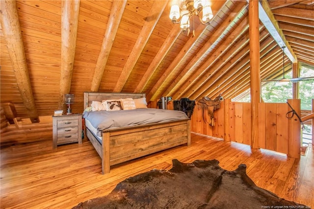 329 Silver Grove Church Rd, Rockingham, NC 28379 - bedroom with light wood-style floors, wood ceiling, a chandelier, and wood walls