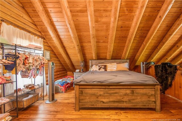 329 Silver Grove Church Rd, Rockingham, NC 28379 - bedroom featuring wooden ceiling, light wood-style floors, and rustic walls