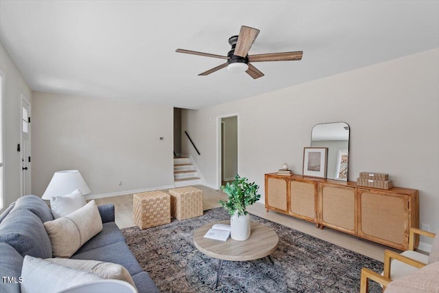 living room with ceiling fan and hardwood / wood-style floors