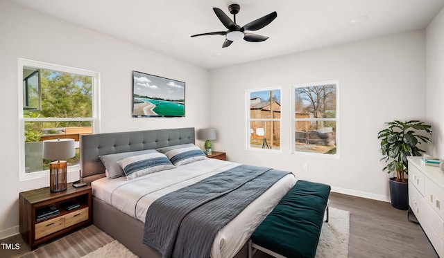 bedroom featuring hardwood / wood-style floors and ceiling fan