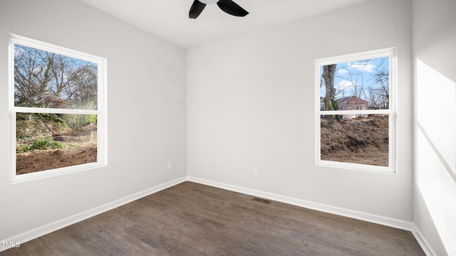 unfurnished room featuring ceiling fan and dark hardwood / wood-style floors