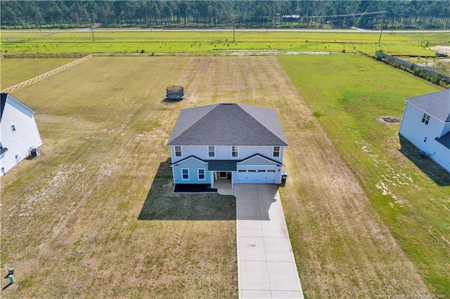 birds eye view of property featuring a rural view