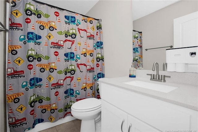 bathroom featuring tile patterned flooring, vanity, toilet, and a shower with shower curtain