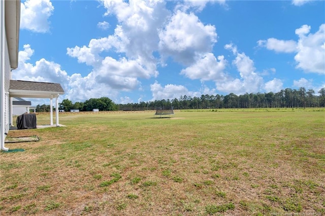 view of yard with a rural view