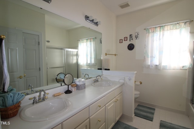 full bath with double vanity, visible vents, a sink, and an enclosed shower