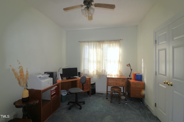 carpeted office featuring a ceiling fan