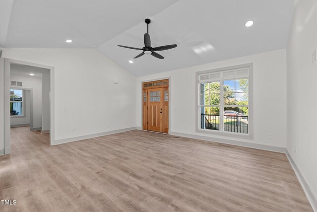 unfurnished living room with light wood-type flooring, vaulted ceiling, and ceiling fan