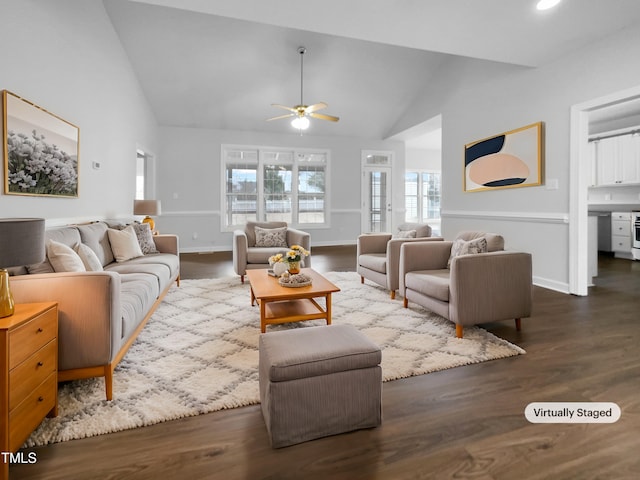 living room featuring dark hardwood / wood-style flooring, vaulted ceiling, and ceiling fan