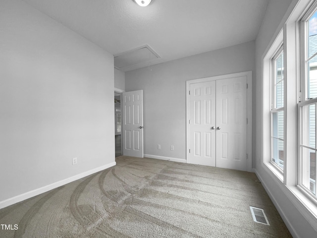 carpeted bedroom featuring a closet