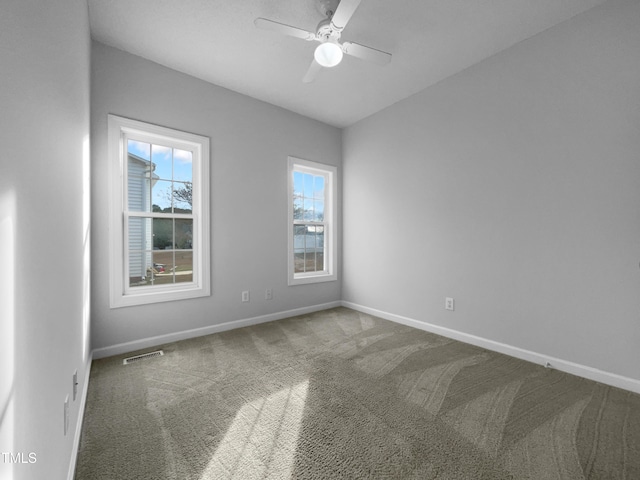 unfurnished room with carpet and ceiling fan