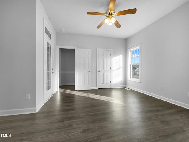 spare room featuring ceiling fan, dark hardwood / wood-style floors, and french doors