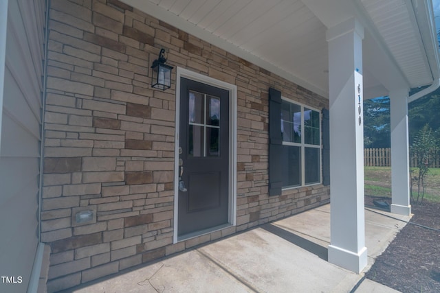 doorway to property with covered porch