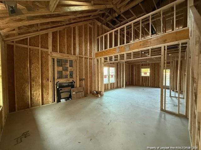 miscellaneous room featuring high vaulted ceiling