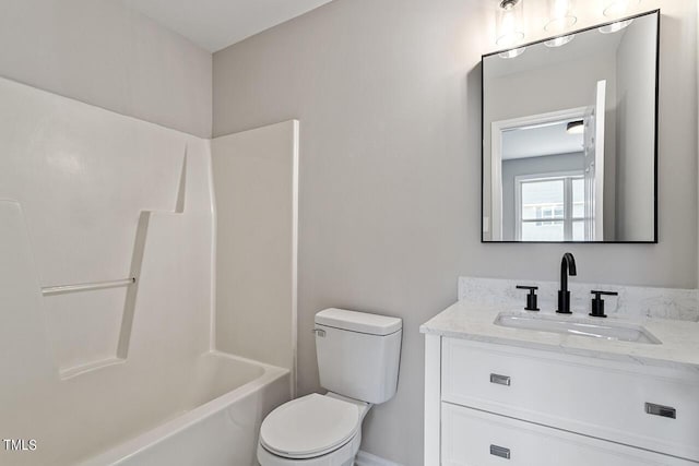 full bathroom with vanity, toilet, and  shower combination