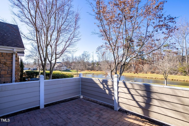 view of patio featuring a water view