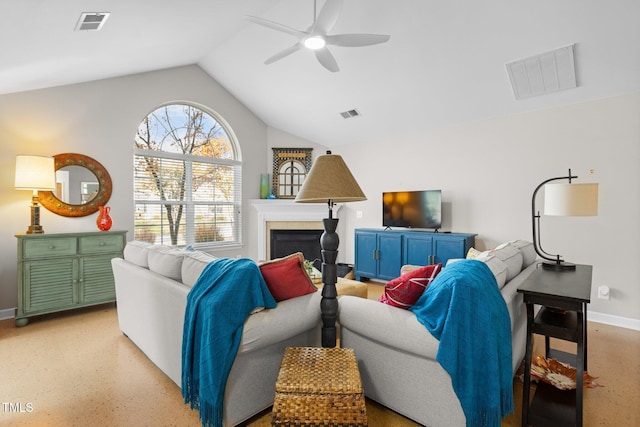 living room with ceiling fan and vaulted ceiling