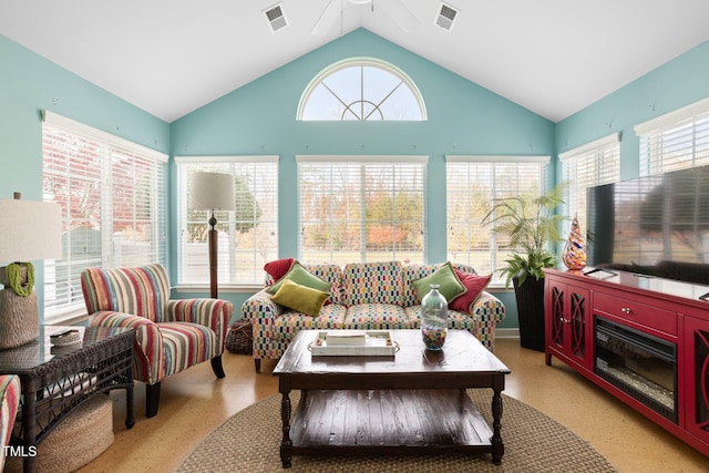 interior space featuring ceiling fan and vaulted ceiling