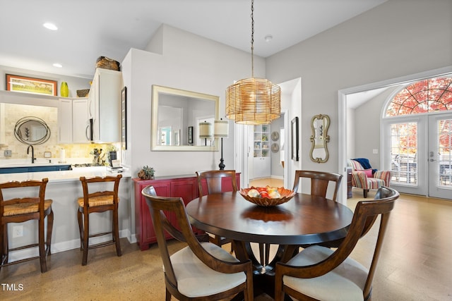 dining area with french doors and sink