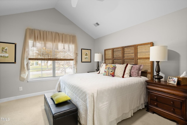 carpeted bedroom with ceiling fan and vaulted ceiling