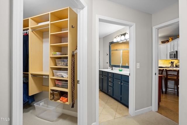 bathroom with vanity and tile patterned floors