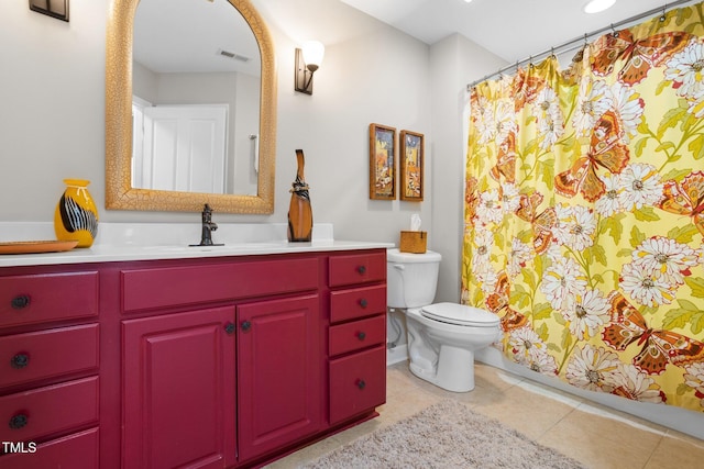 bathroom with tile patterned floors, vanity, and toilet