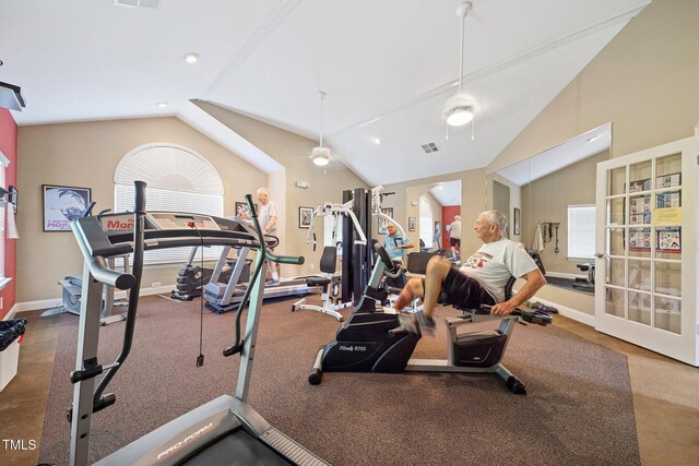 exercise area with ceiling fan and vaulted ceiling