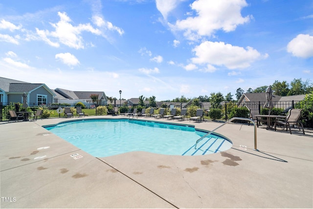 view of swimming pool with a patio area