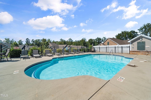 view of swimming pool with a patio area