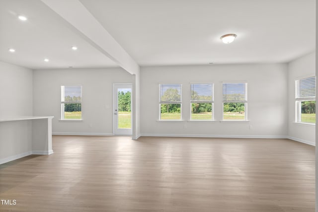 unfurnished living room featuring light hardwood / wood-style flooring