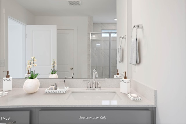 bathroom with vanity and an enclosed shower