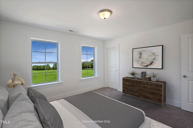 bedroom featuring dark colored carpet