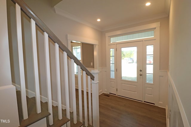 foyer with crown molding and dark wood-type flooring