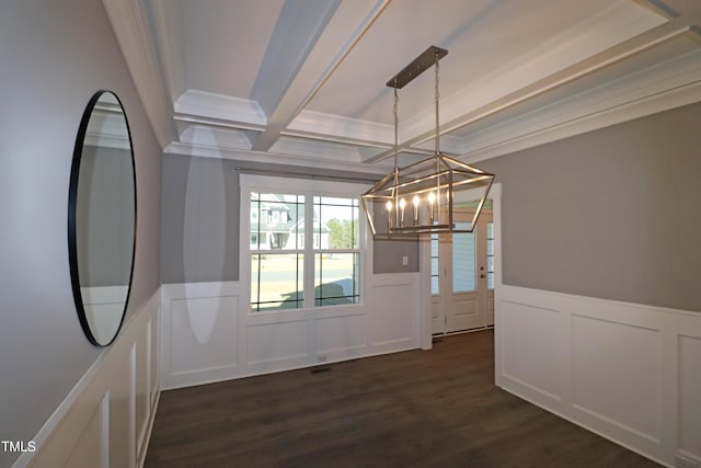 unfurnished dining area with dark hardwood / wood-style flooring, coffered ceiling, crown molding, a notable chandelier, and beamed ceiling