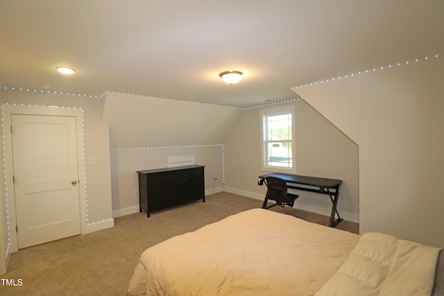 carpeted bedroom with vaulted ceiling