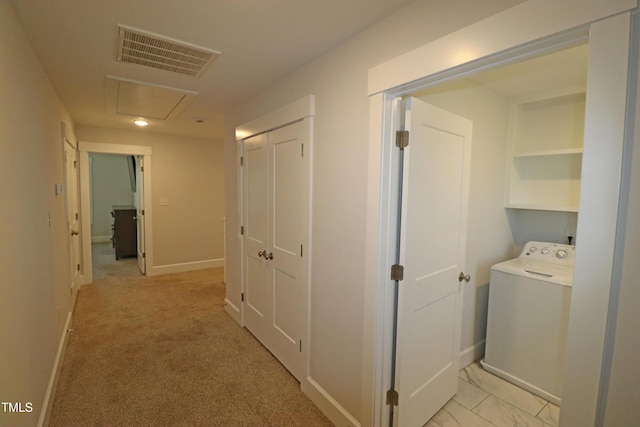 corridor with washer / clothes dryer