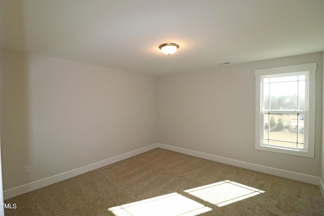 unfurnished room featuring carpet floors