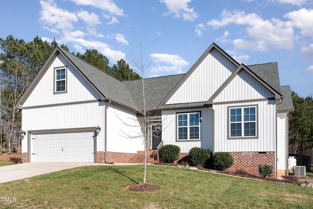 modern farmhouse with a front yard and a garage