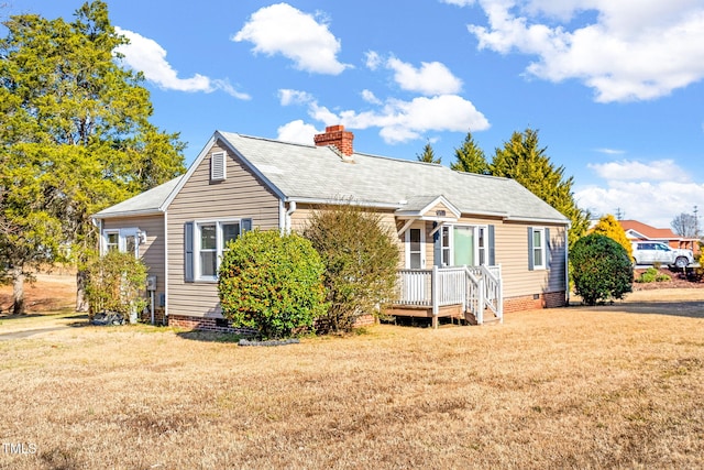 bungalow-style home with a front yard