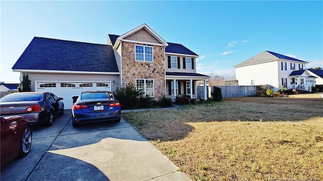 view of front of property featuring a front yard and a garage