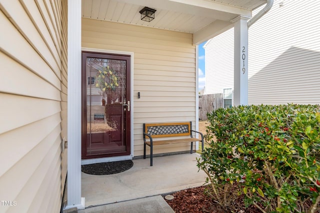 property entrance with covered porch