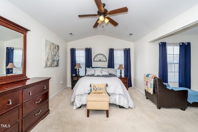 bedroom featuring lofted ceiling, light colored carpet, and ceiling fan