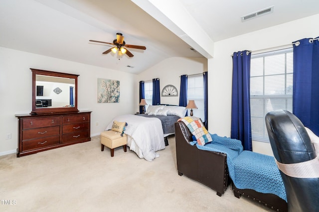 bedroom with lofted ceiling, light carpet, and ceiling fan