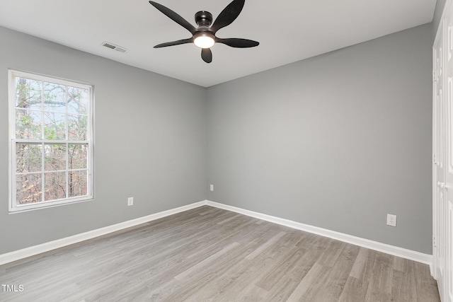 spare room featuring ceiling fan and light hardwood / wood-style floors