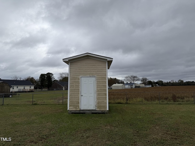 view of outbuilding with a lawn