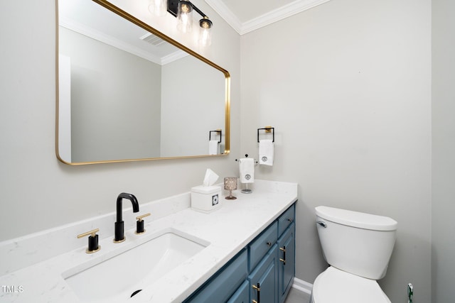 bathroom featuring crown molding, vanity, and toilet