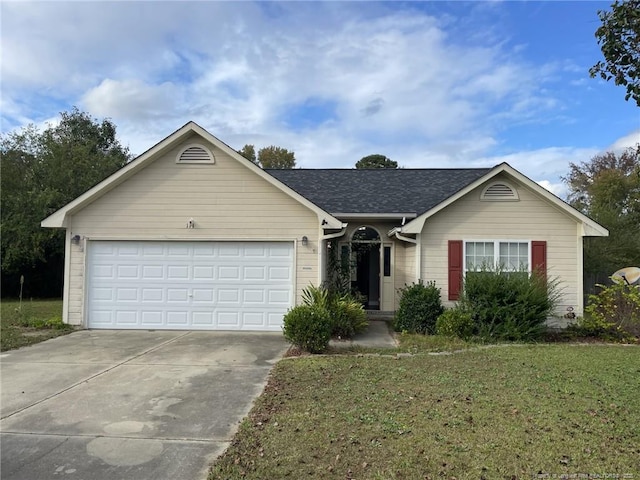 ranch-style home with a front yard and a garage